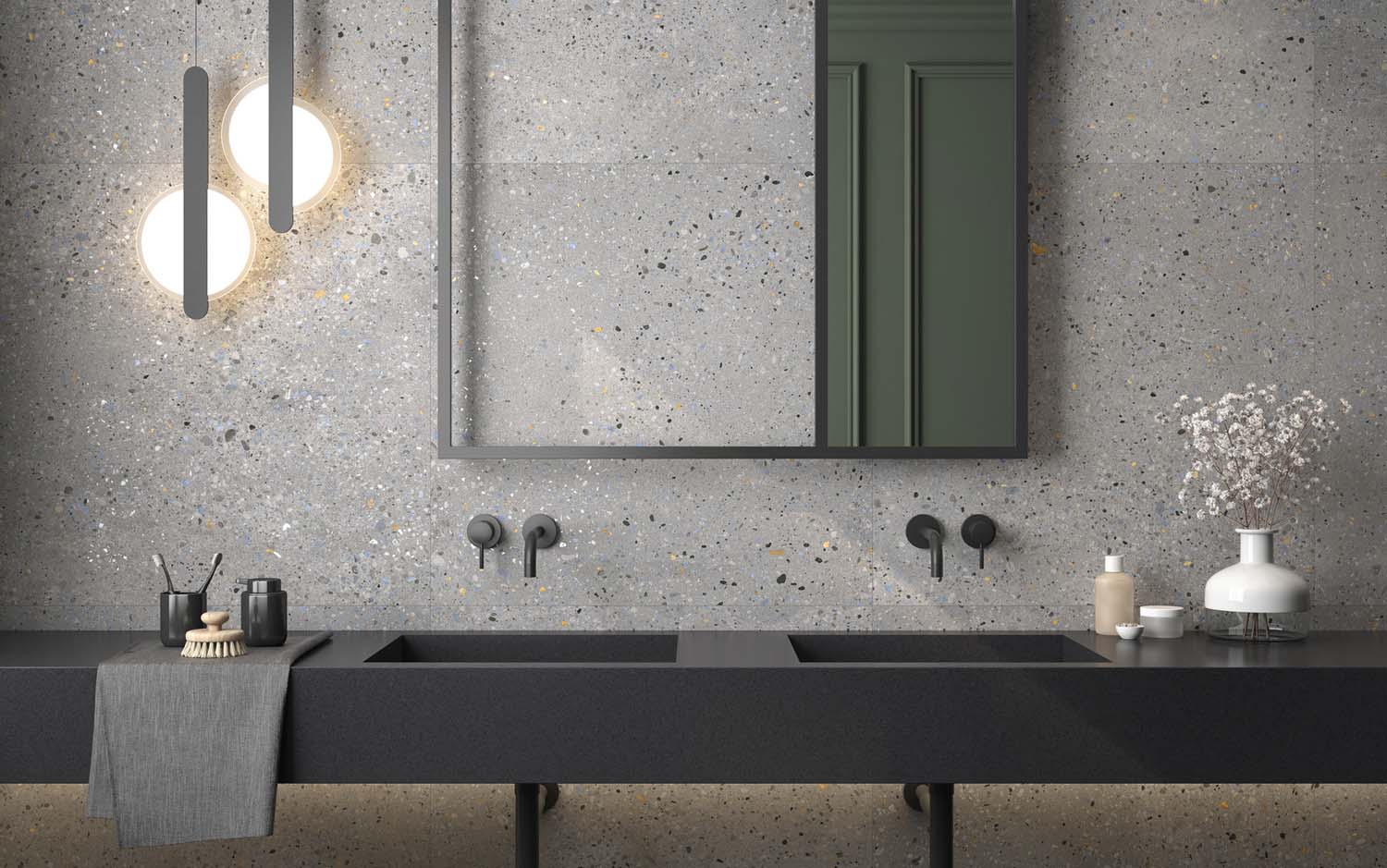 Un baño con revestimiento de terrazo multicolor